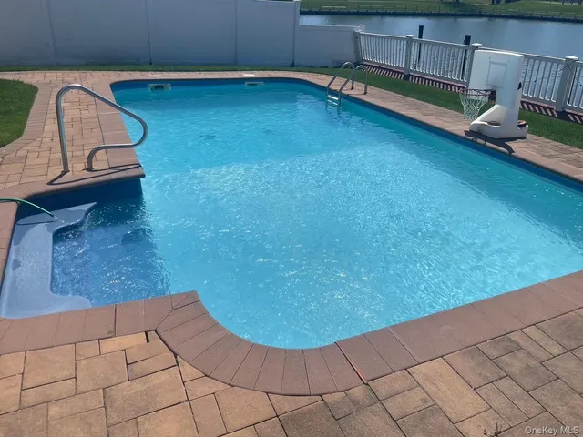 a view of a room with wooden floor and window