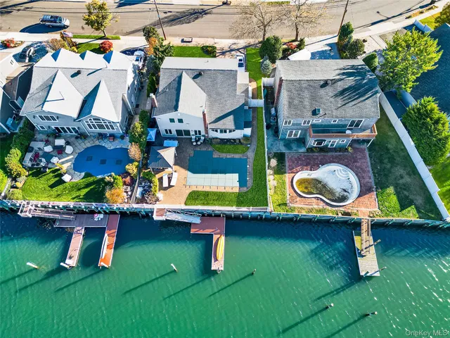 an aerial view of a house with swimming pool garden and outdoor seating
