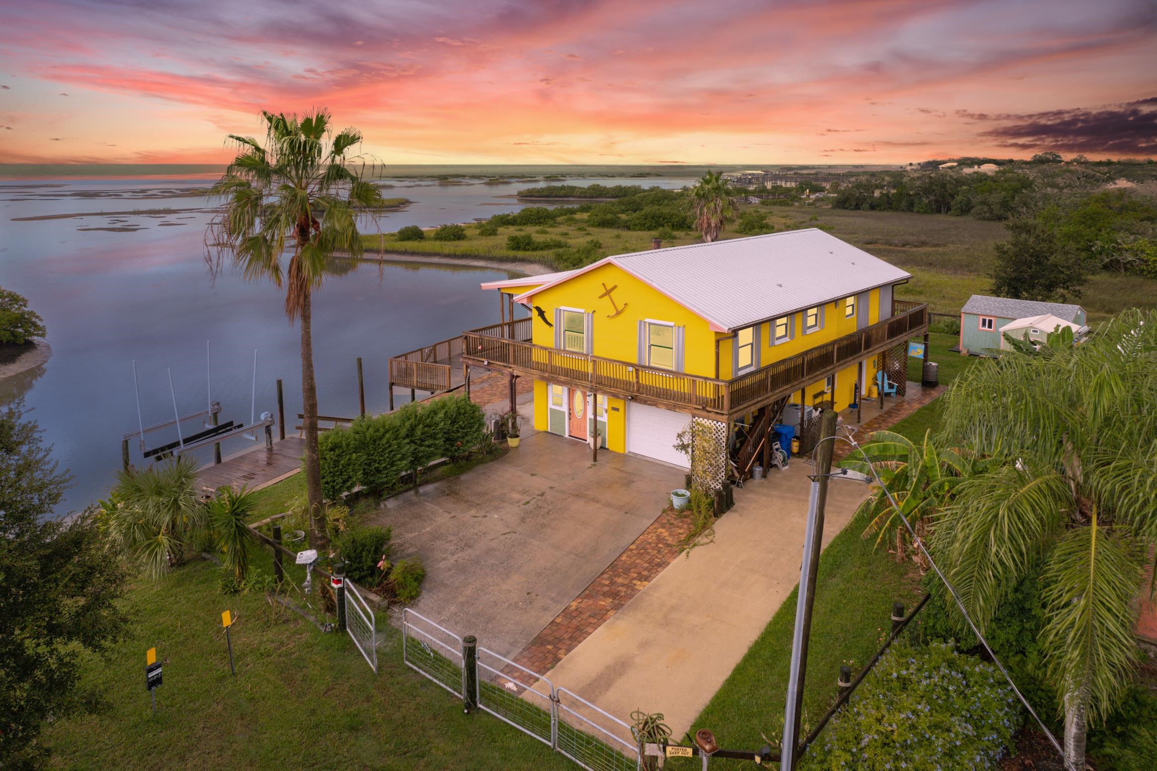 298 Majorca Road St. Augustine, FL 32080 - Photo 1 of 40 an aerial view of a house with a big yard