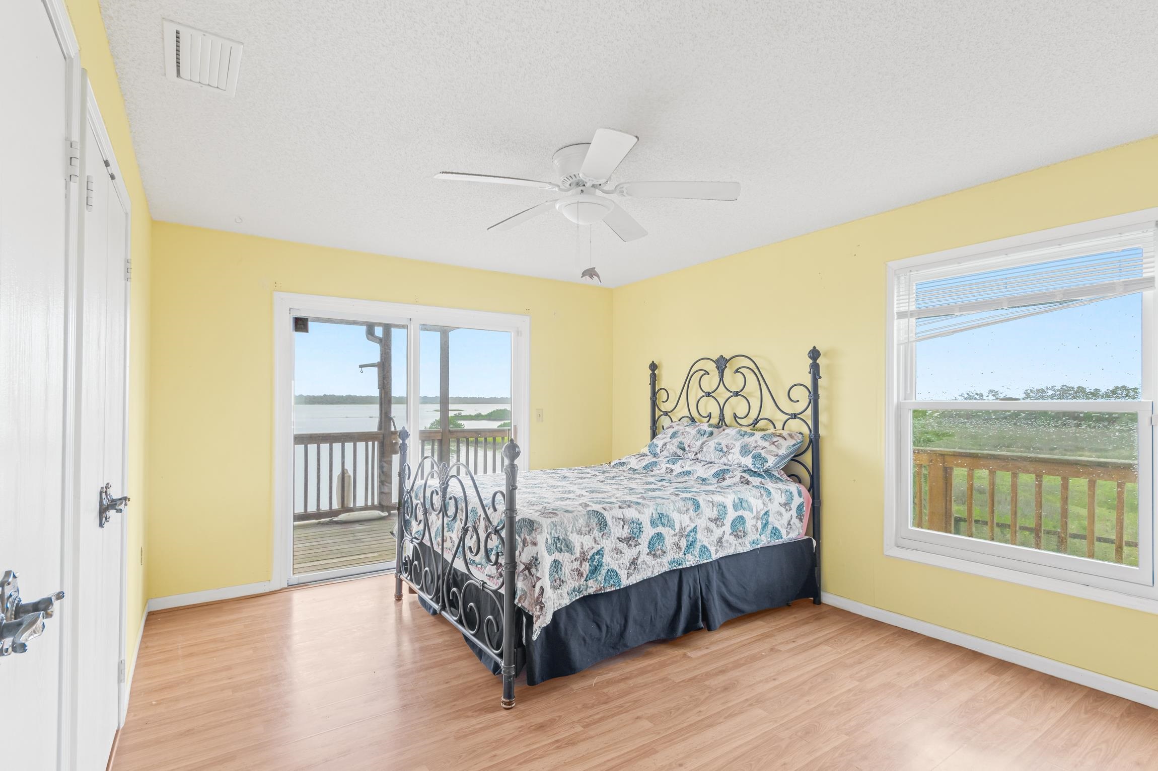 298 Majorca Road St. Augustine, FL 32080 - Photo 12 of 40 a bedroom with a bed and a window