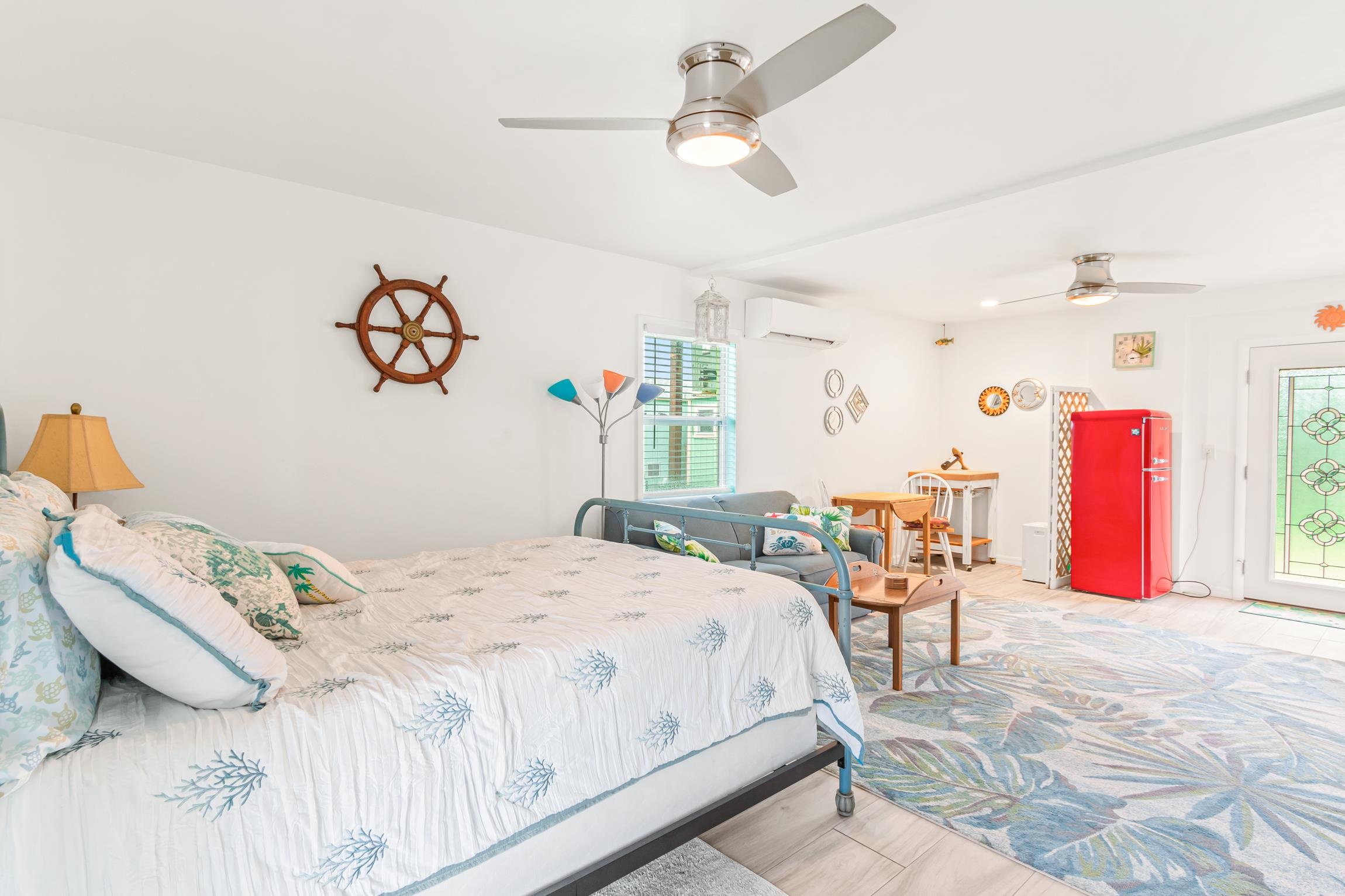 298 Majorca Road St. Augustine, FL 32080 - Photo 18 of 40 a bedroom with a bed and a table in it
