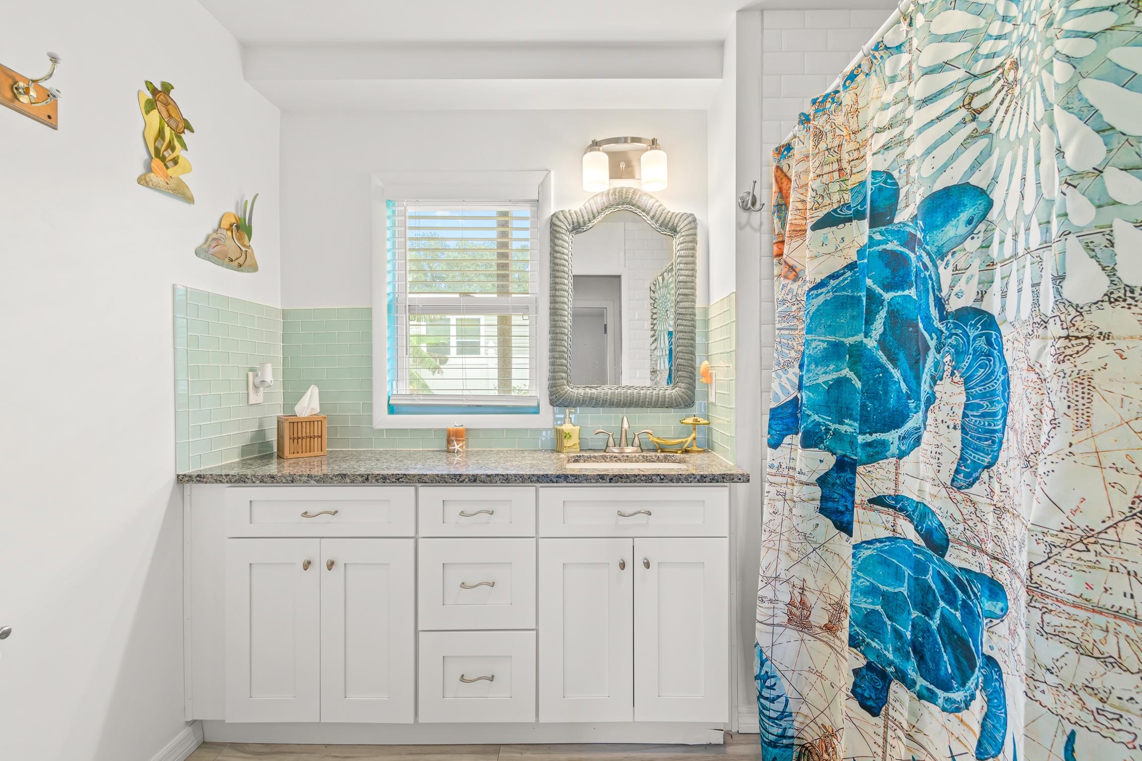298 Majorca Road St. Augustine, FL 32080 - Photo 19 of 40 a bathroom with a granite countertop sink and a mirror