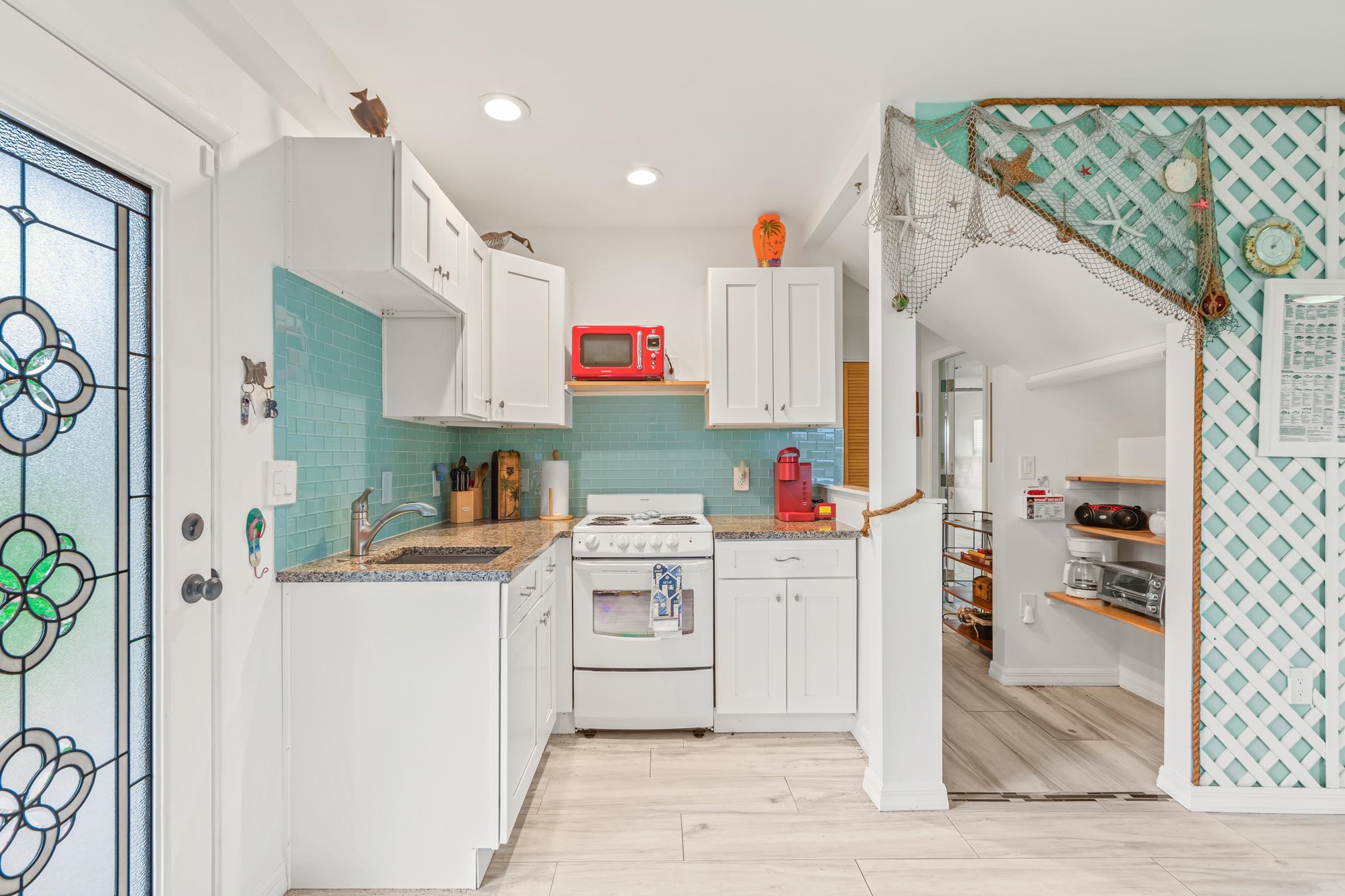 298 Majorca Road St. Augustine, FL 32080 - Photo 21 of 40 a kitchen with a refrigerator and a stove top oven