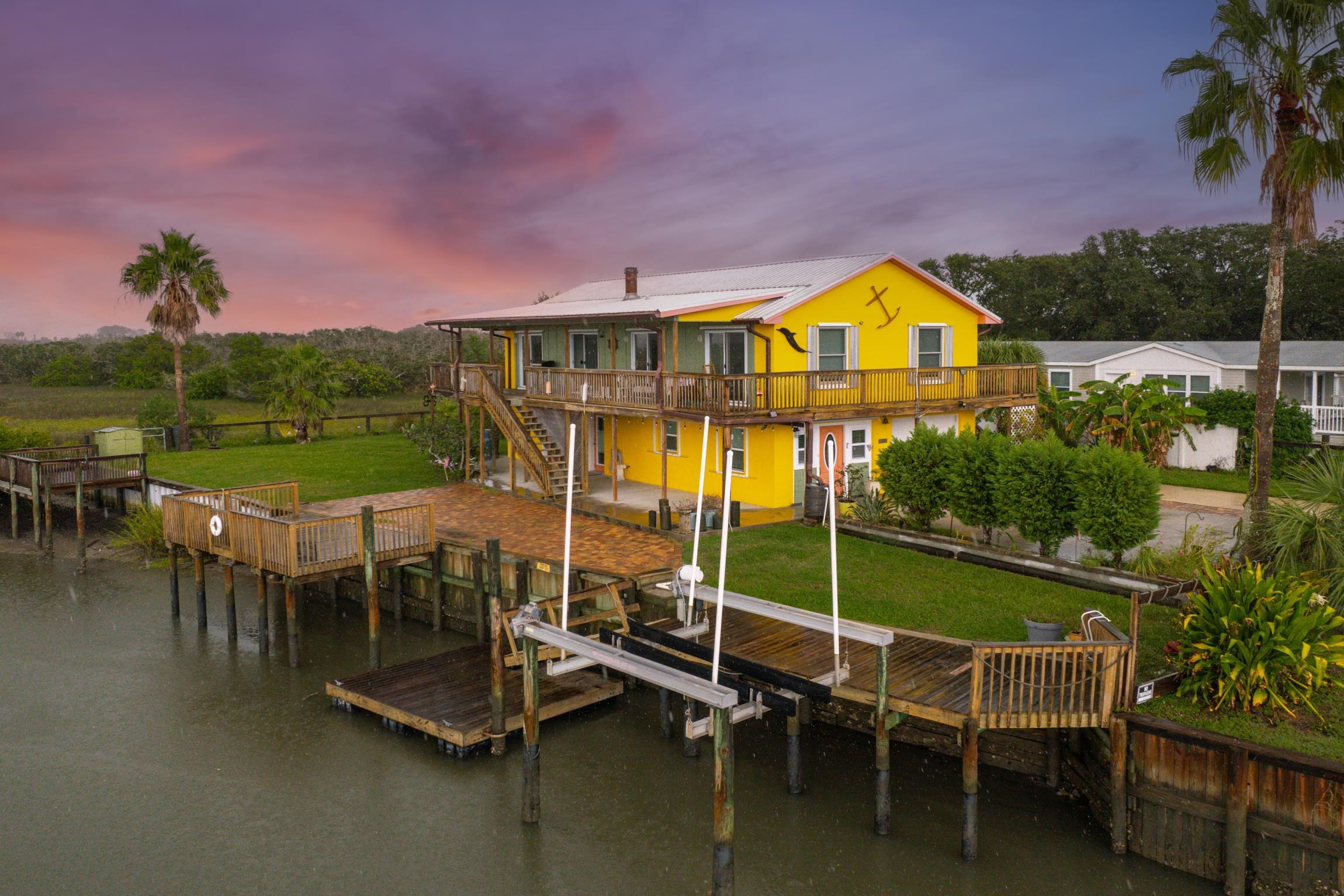 298 Majorca Road St. Augustine, FL 32080 - Photo 30 of 40 a view of a swimming pool with a table and chairs
