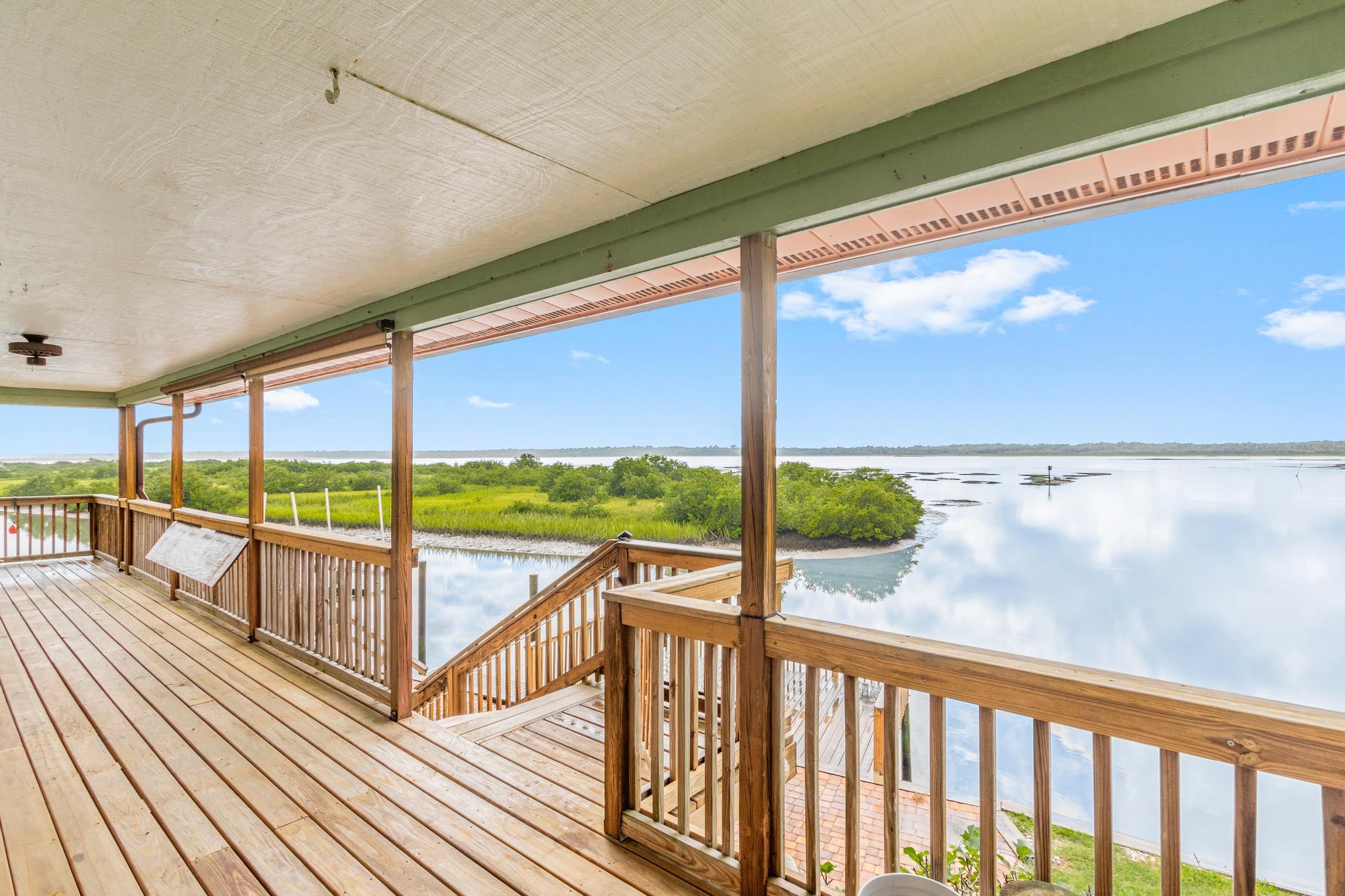 298 Majorca Road St. Augustine, FL 32080 - Photo 32 of 40 a view of a porch with wooden floor