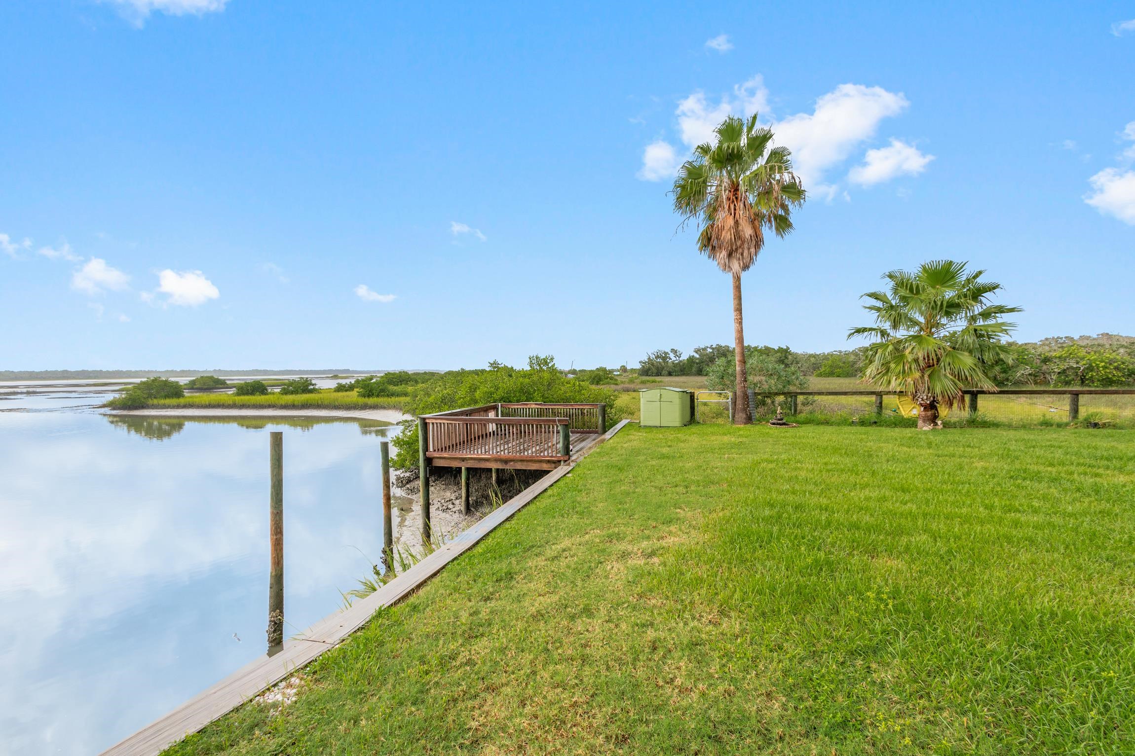 298 Majorca Road St. Augustine, FL 32080 - Photo 33 of 40 a view of a swimming pool with a table and chairs