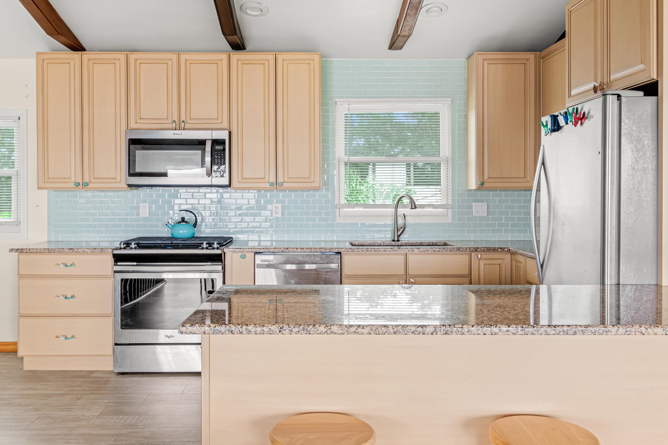 298 Majorca Road St. Augustine, FL 32080 - Photo 7 of 40 a kitchen with stainless steel appliances granite countertop a sink stove and refrigerator
