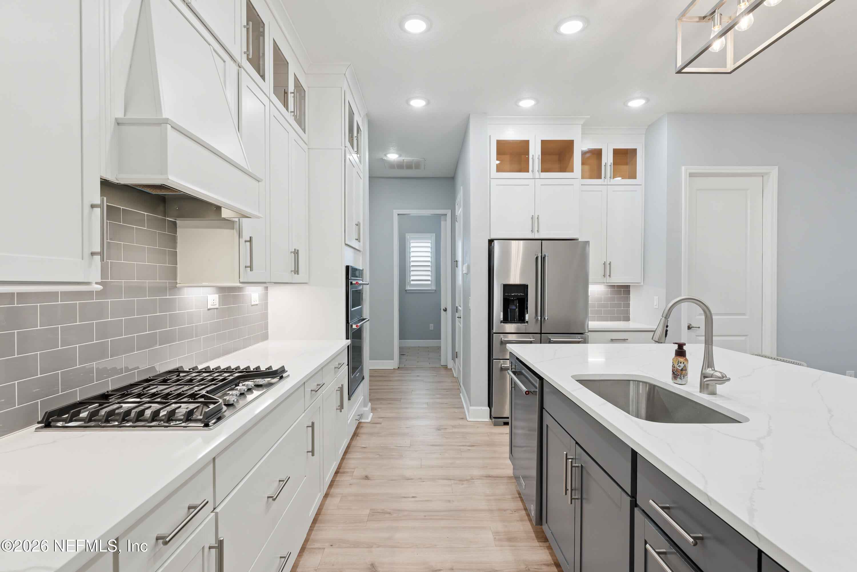 408 Rustic Mill Drive St. Augustine, FL 32092 - Photo 15 of 31 a large kitchen with stainless steel appliances kitchen island granite countertop a sink and cabinets