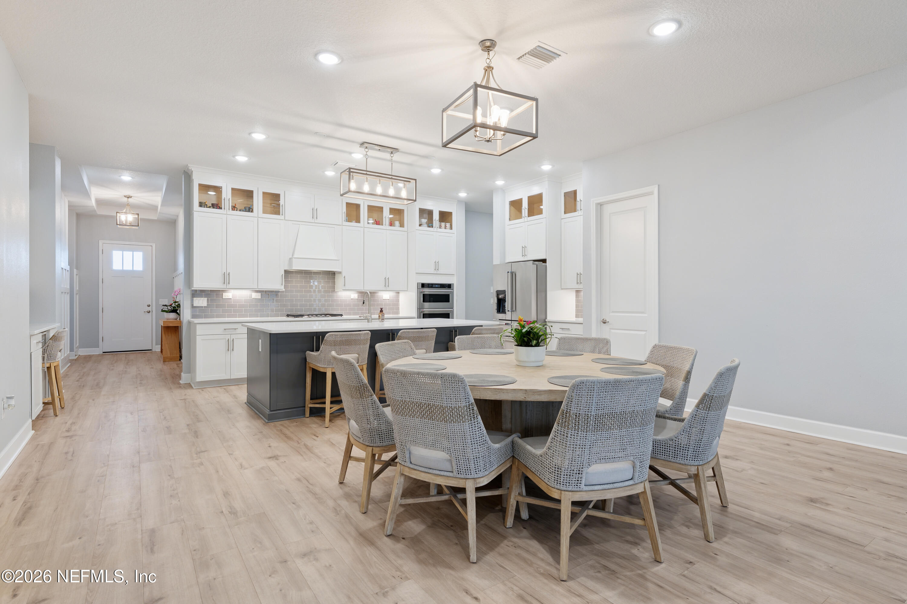 408 Rustic Mill Drive St. Augustine, FL 32092 - Photo 16 of 31 a view of a dining room with furniture and wooden floor