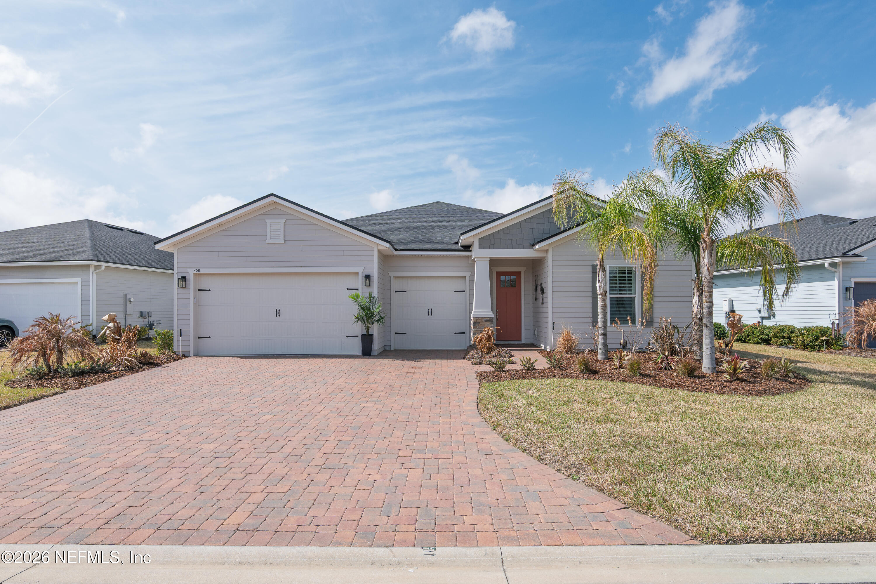408 Rustic Mill Drive St. Augustine, FL 32092 - Photo 2 of 31 a front view of a house with a yard and garage