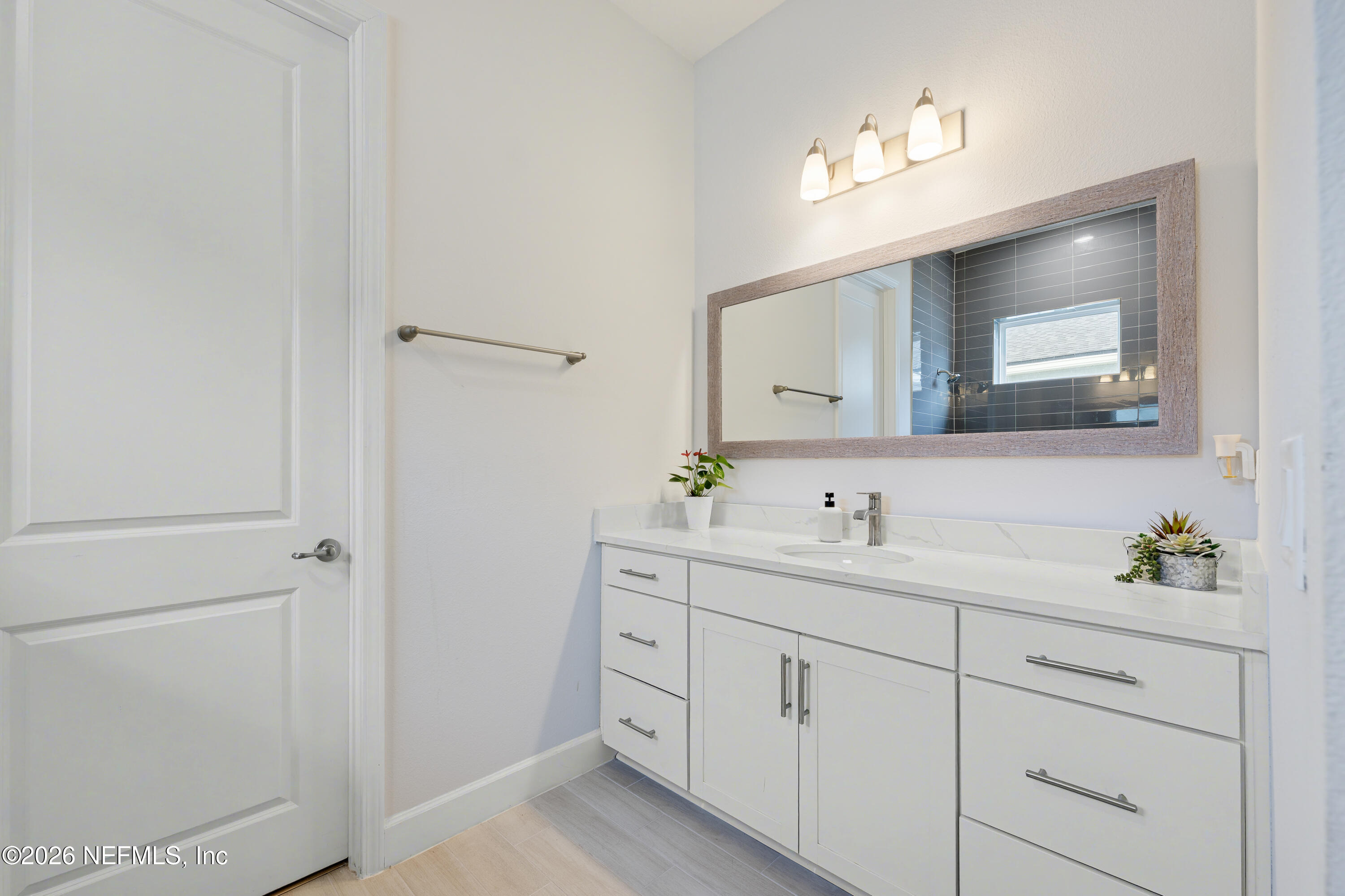 408 Rustic Mill Drive St. Augustine, FL 32092 - Photo 21 of 31 a bathroom with a double vanity sink and mirror
