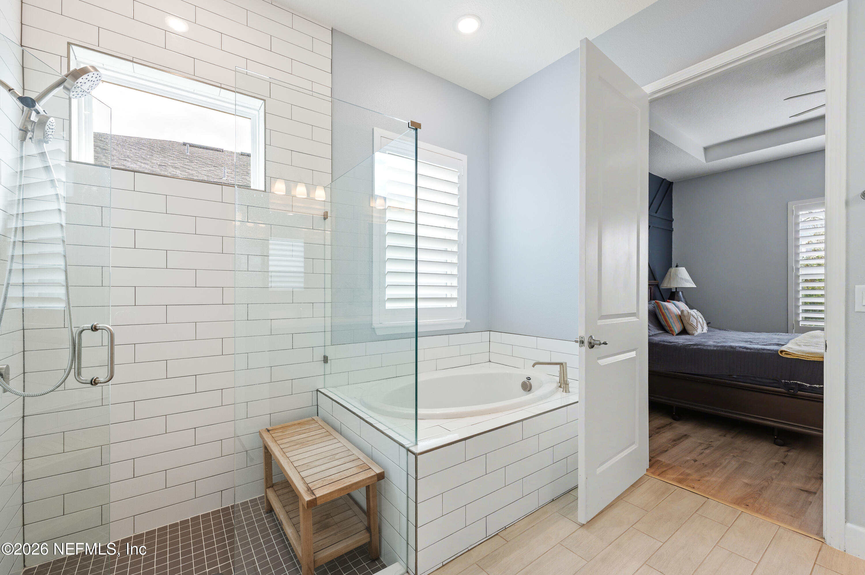 408 Rustic Mill Drive St. Augustine, FL 32092 - Photo 25 of 31 a bathroom with a tub a toilet and a shower