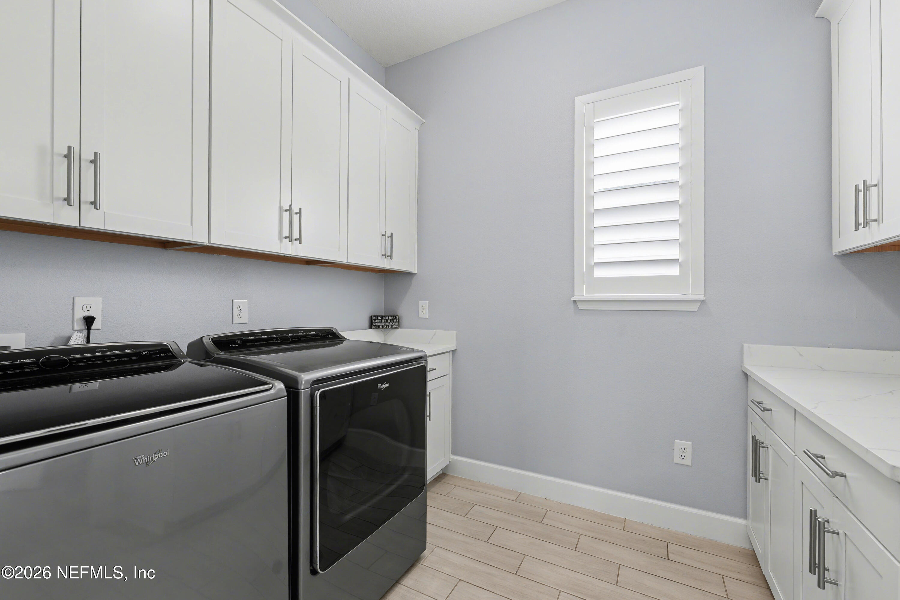408 Rustic Mill Drive St. Augustine, FL 32092 - Photo 26 of 31 a kitchen with granite countertop white cabinets and white appliances