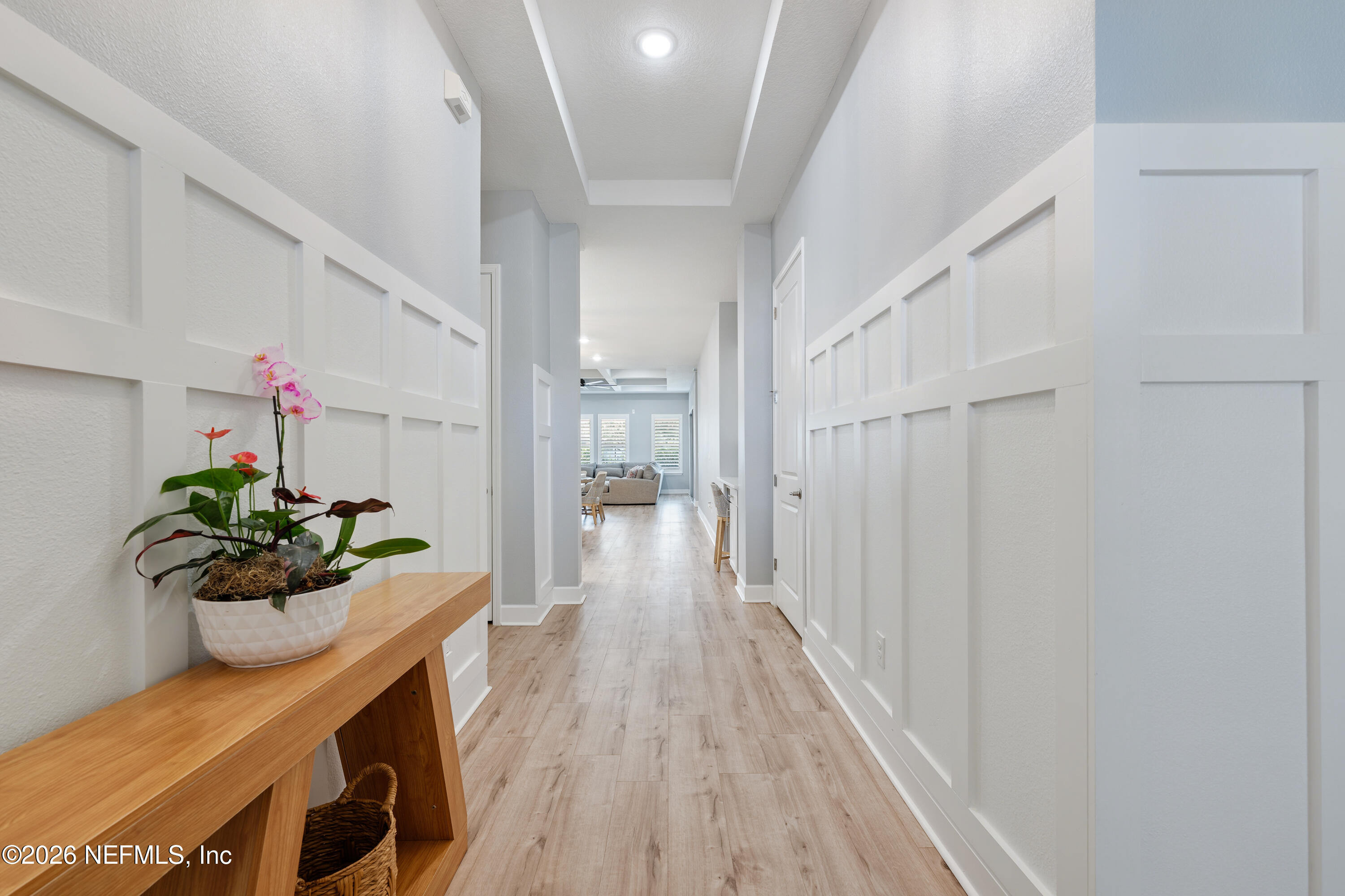 408 Rustic Mill Drive St. Augustine, FL 32092 - Photo 10 of 31 a hallway with wooden floor and a potted plant
