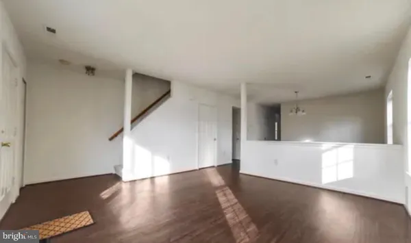 a view of a livingroom with wooden floor
