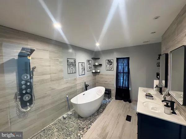 a spacious bathroom with a bathtub sink and toilet