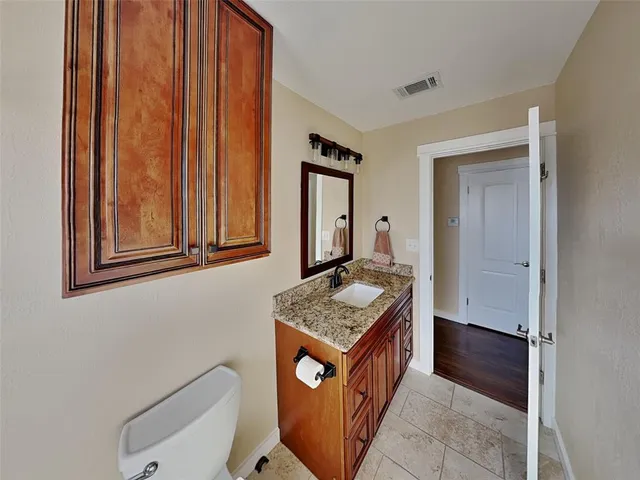 a bathroom with a sink a mirror and a toilet
