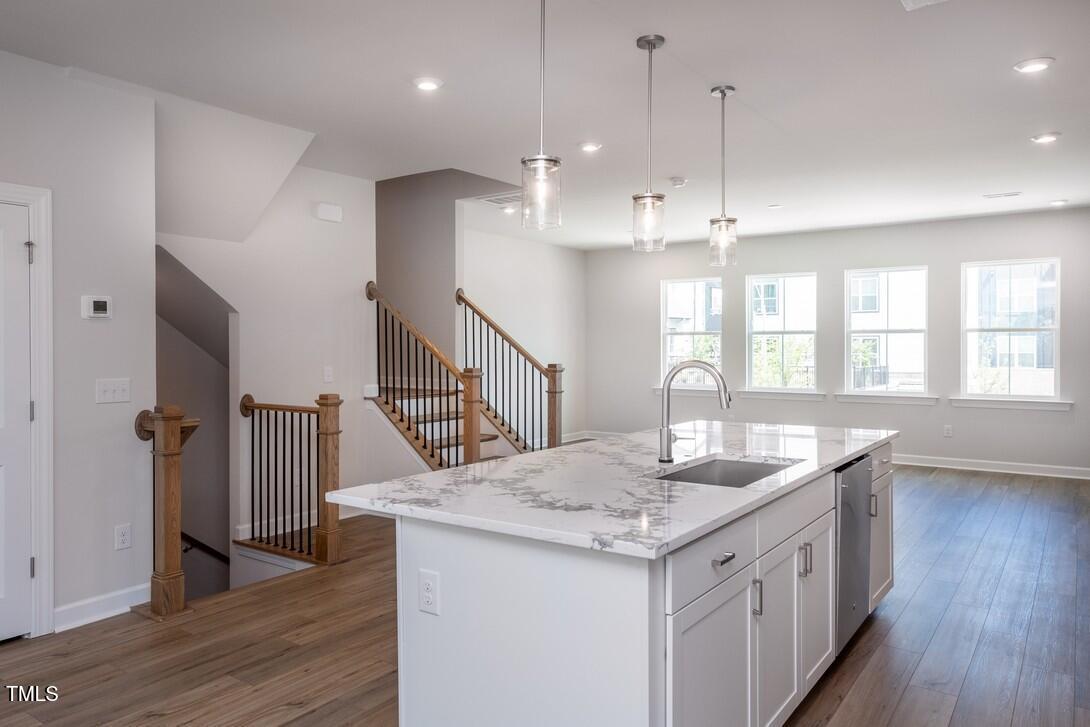 4703 Mint Leaf Lane Raleigh, NC 27612 - Photo 11 of 25 a kitchen with sink and wooden floor