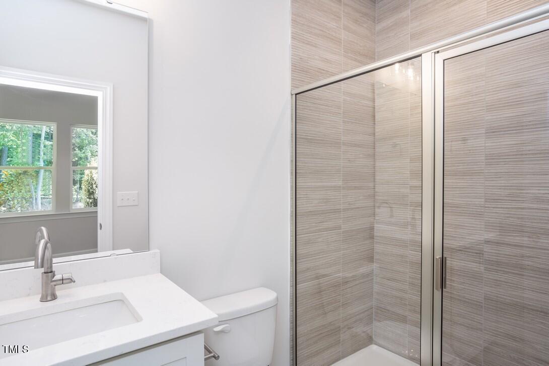 4703 Mint Leaf Lane Raleigh, NC 27612 - Photo 21 of 25 a bathroom with a sink and a vanity
