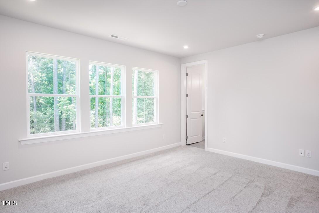 4703 Mint Leaf Lane Raleigh, NC 27612 - Photo 23 of 25 an empty room with a window