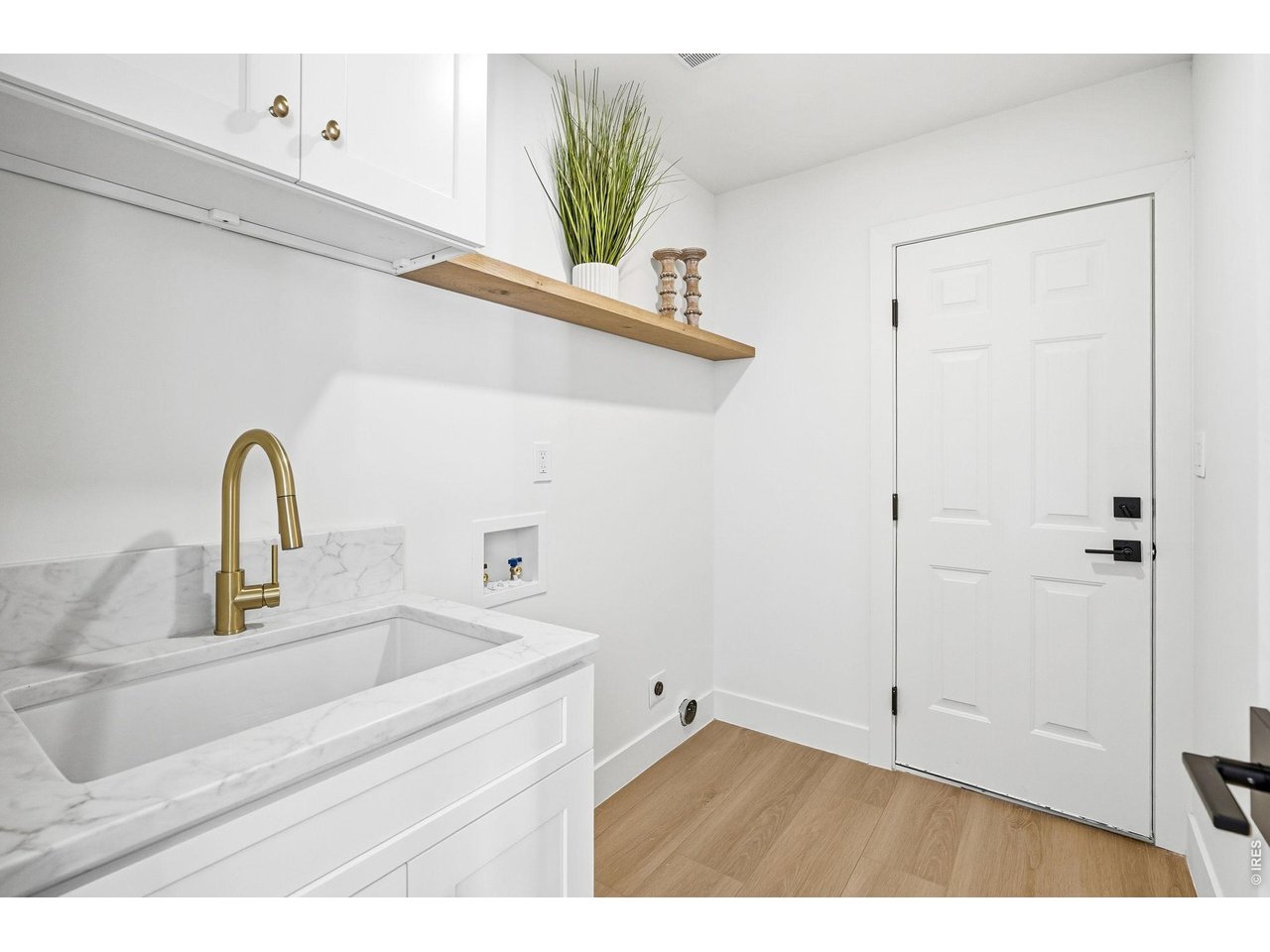 4788 Briar Ridge Trail Boulder, CO 80301 - Photo 36 of 45 Refined, functional laundry room featuring custom cabinetry, dedicated utility sink, and convenient storage solutions.