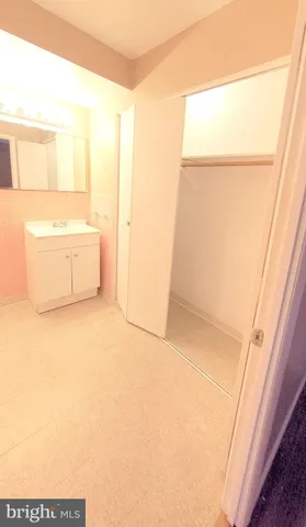 a bathroom with a bathtub and a window