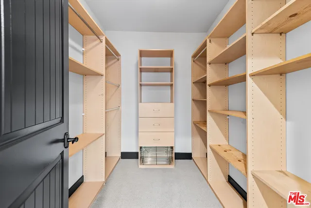 a view of an empty walk in closet