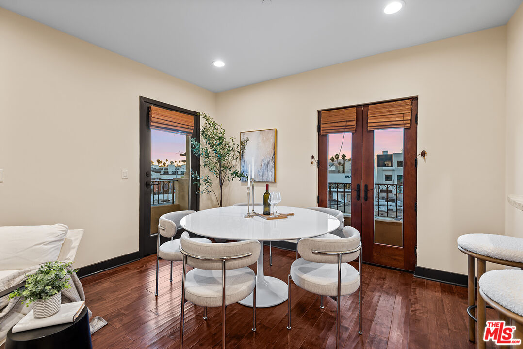 1215 Armacost Avenue, Unit 403 Los Angeles, CA 90025 - Photo 5 of 25 a living room with furniture and a table