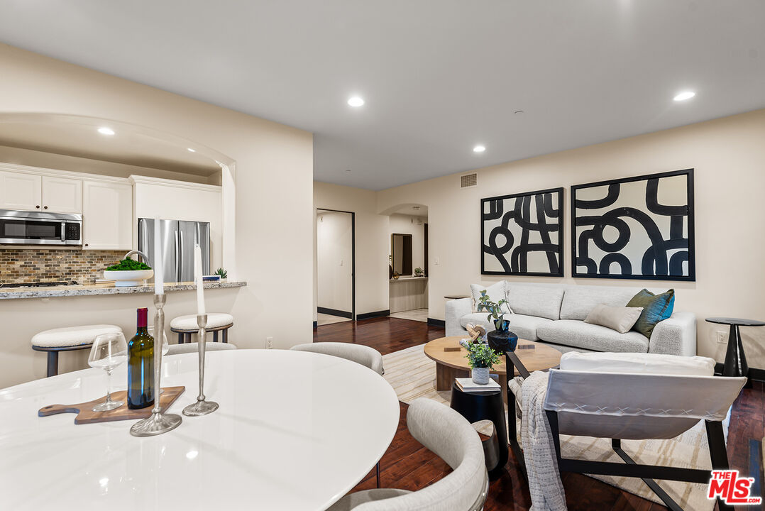 1215 Armacost Avenue, Unit 403 Los Angeles, CA 90025 - Photo 6 of 25 a living room with furniture and kitchen view
