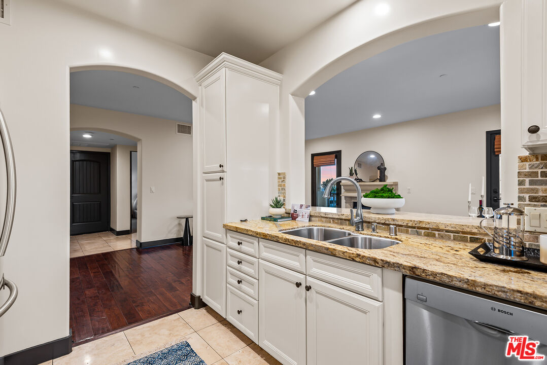 1215 Armacost Avenue, Unit 403 Los Angeles, CA 90025 - Photo 9 of 25 a spacious bathroom with double sink and a mirror