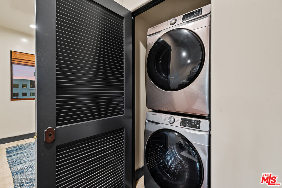 1215 Armacost Avenue, Unit 403 Los Angeles, CA 90025 - Photo 10 of 25 a view of a hallway with washer and dryer