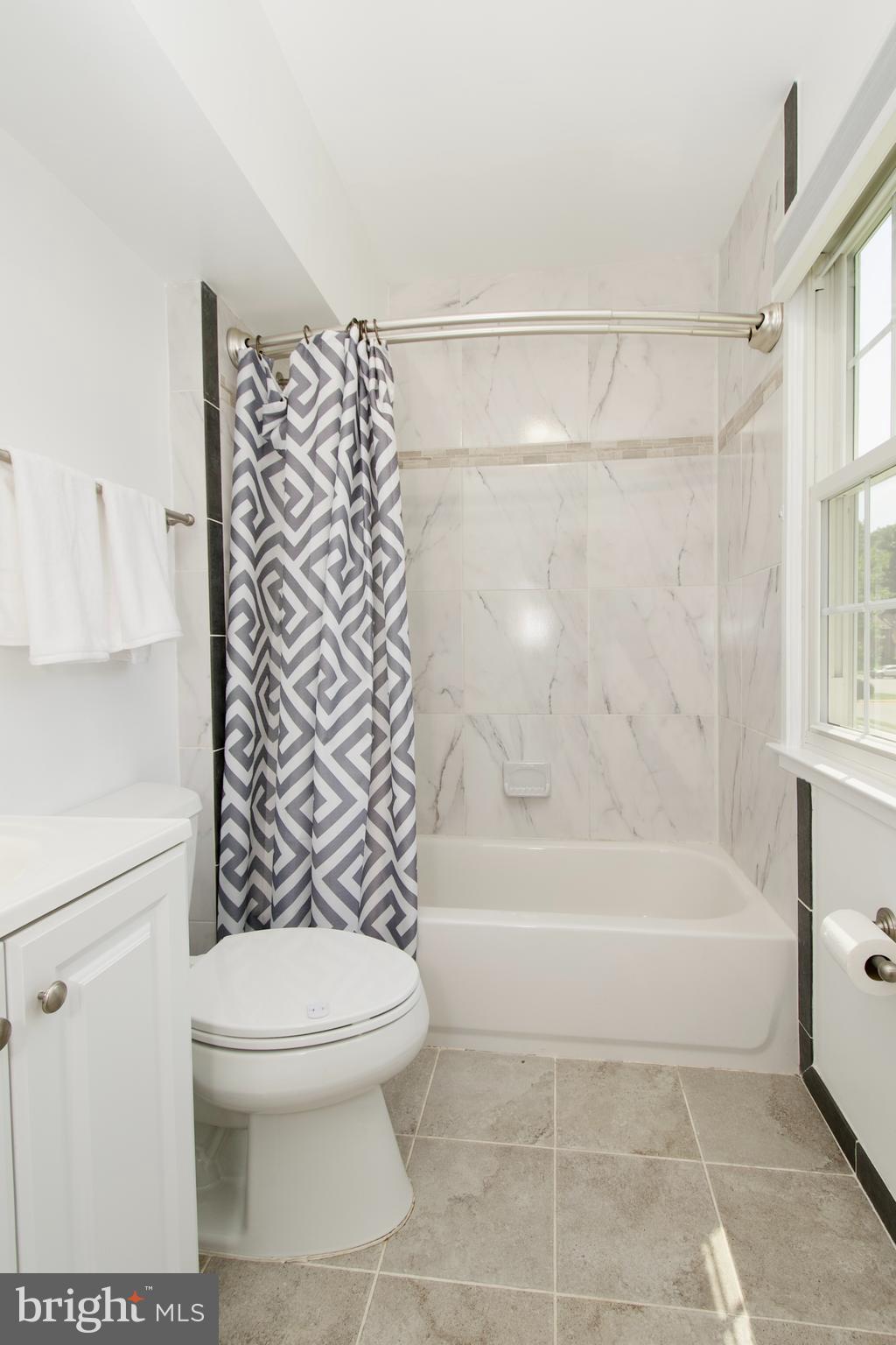 7726 Matisse Way Springfield, VA 22153 - Photo 28 of 34 a bathroom with a toilet and a bathtub