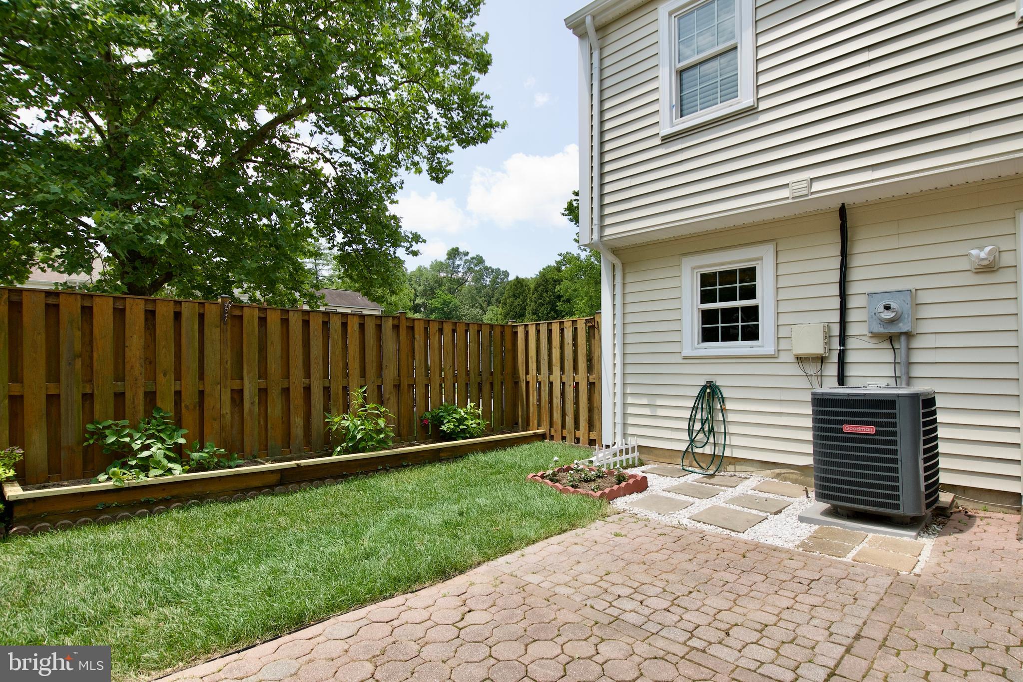 7726 Matisse Way Springfield, VA 22153 - Photo 31 of 34 a backyard of a house with barbeque oven