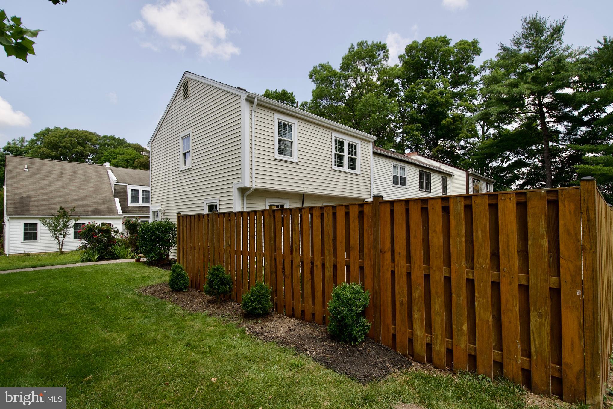7726 Matisse Way Springfield, VA 22153 - Photo 34 of 34 a backyard of a house with wooden fence