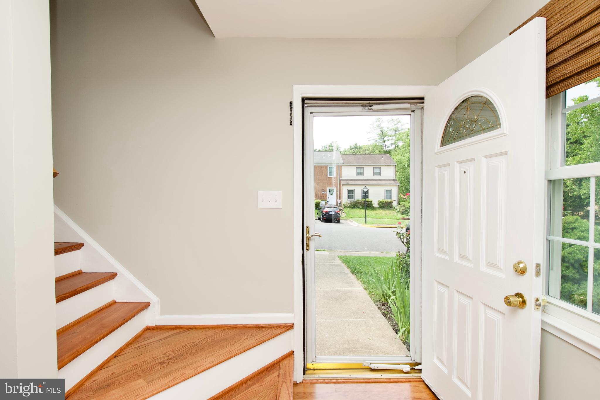 7726 Matisse Way Springfield, VA 22153 - Photo 5 of 34 a view of an entryway with staircase