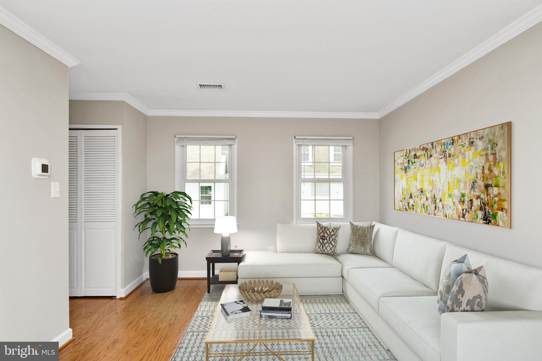 7726 Matisse Way Springfield, VA 22153 - Photo 8 of 34 a living room with furniture and a potted plant