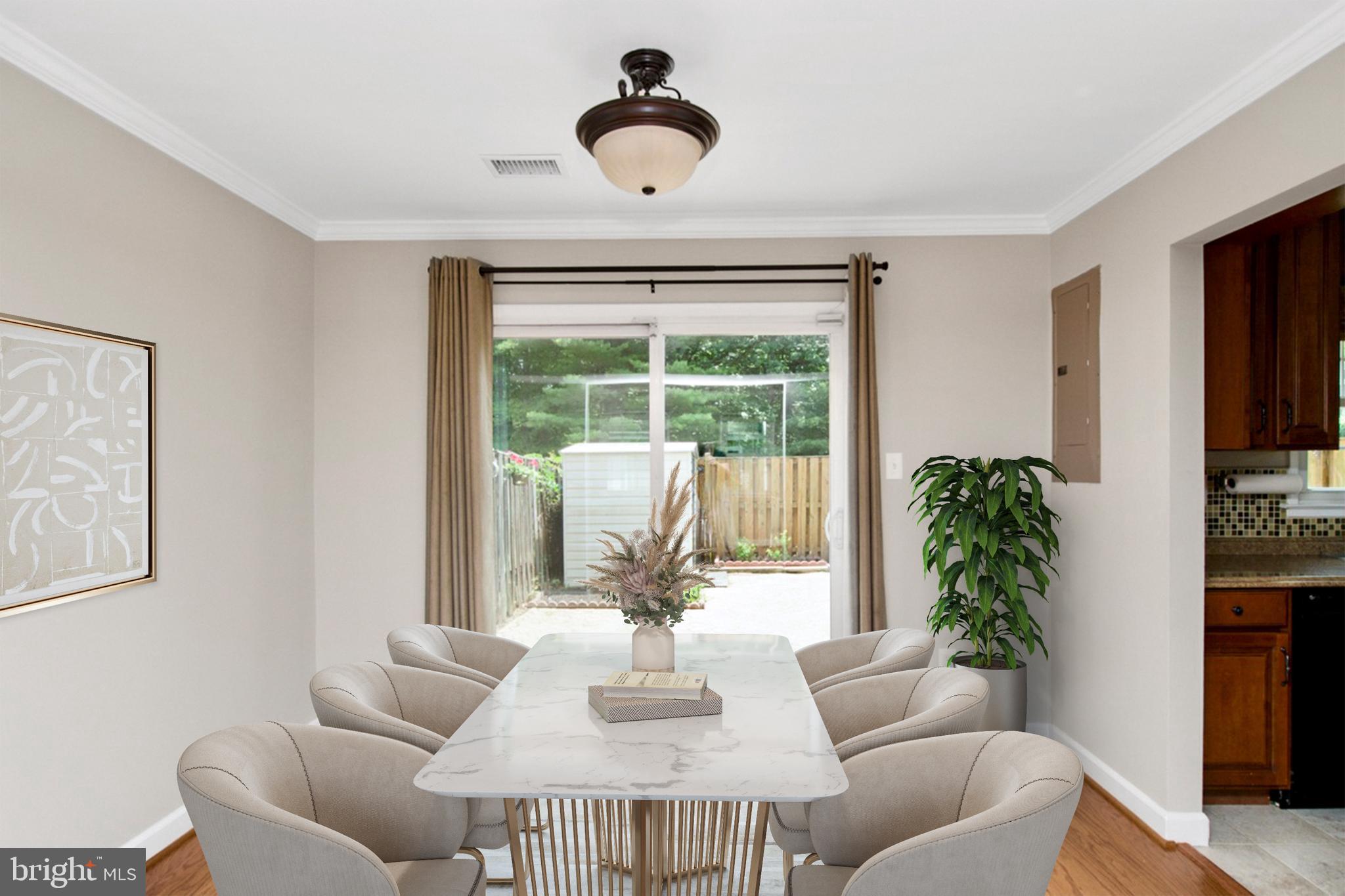 7726 Matisse Way Springfield, VA 22153 - Photo 10 of 34 a living room with furniture and a potted plant