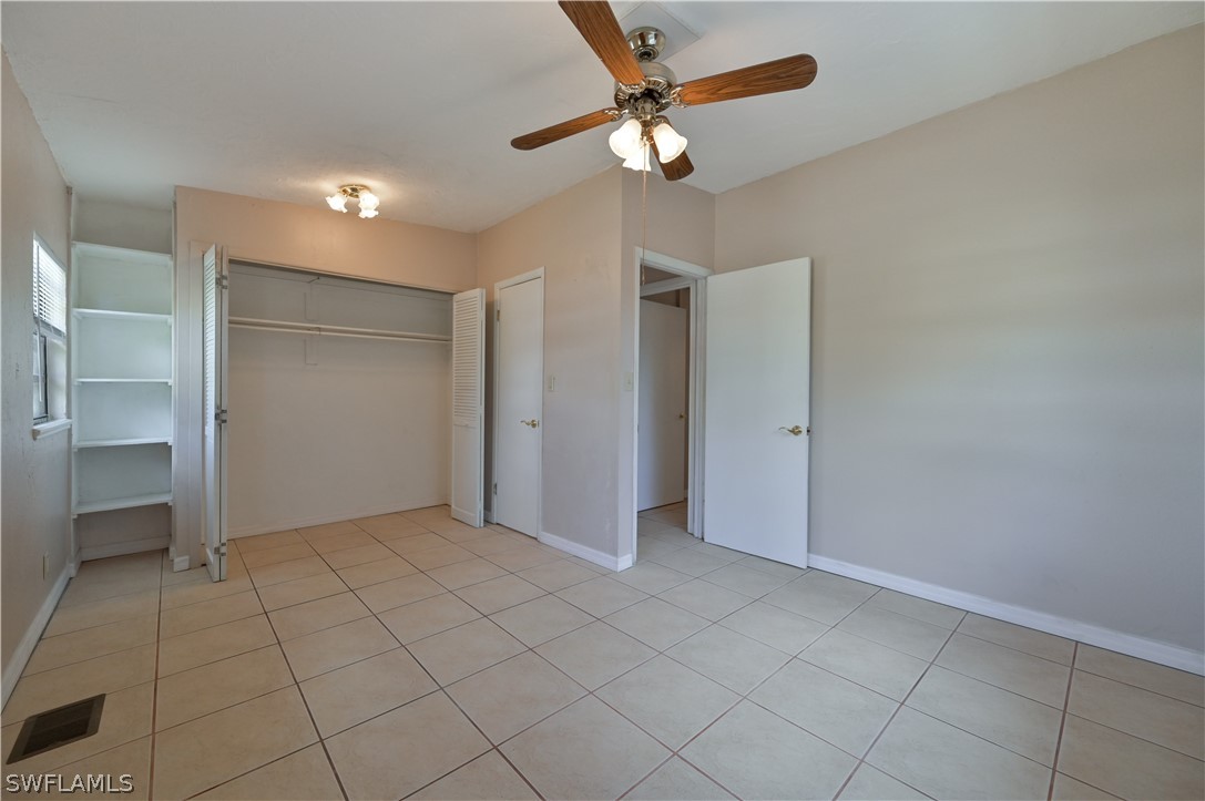 8500 Judeth Lane Estero, FL 33928 - Photo 13 of 19 an empty room with closet and fan