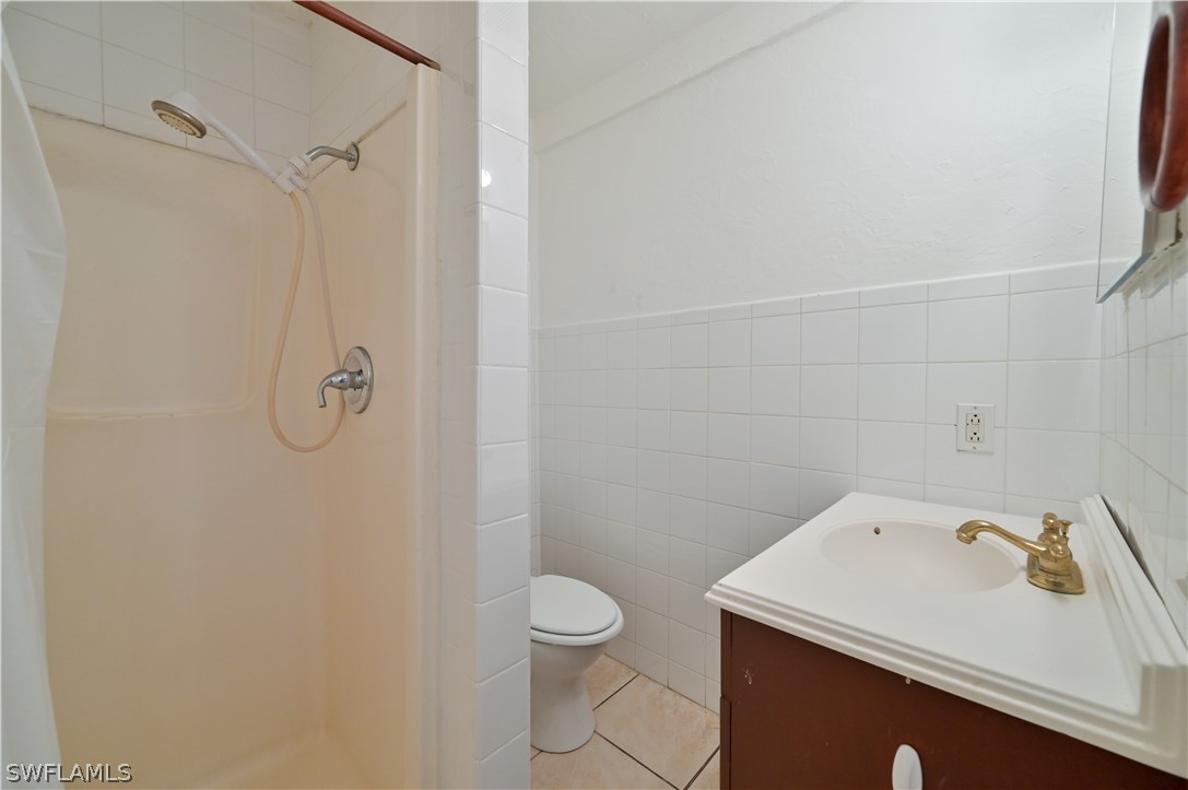 8500 Judeth Lane Estero, FL 33928 - Photo 15 of 19 a bathroom with a sink a toilet and a shower