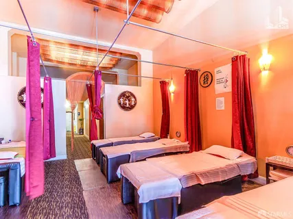 a bedroom with a bed and a table