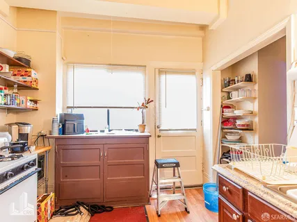 a room with a window closet and a chair