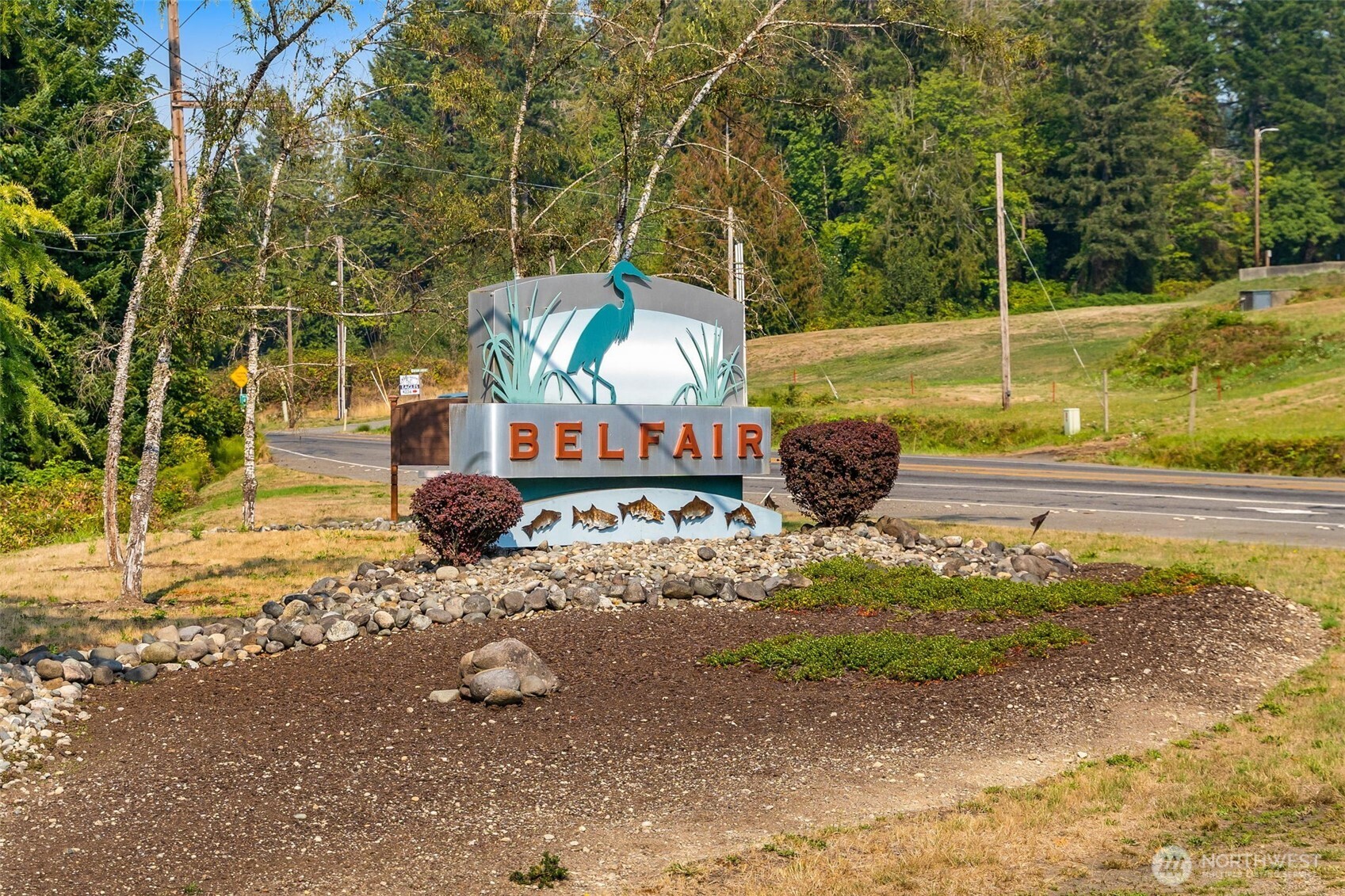 70 East Windy Ridge Lane Belfair, WA 98528 - Photo 2 of 9 a view of a house with a yard