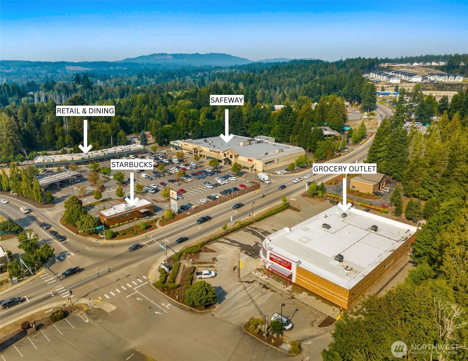 70 East Windy Ridge Lane Belfair, WA 98528 - Photo 8 of 9 an aerial view of a house with a garden and lake view