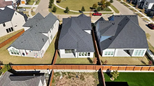 an aerial view of houses with outdoor space