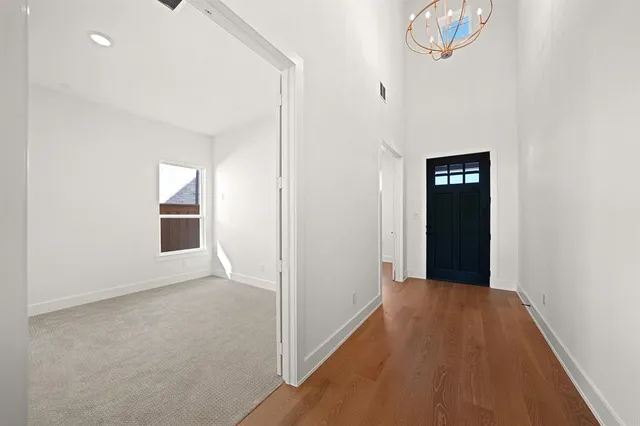 wooden floor in a hall with an entryway