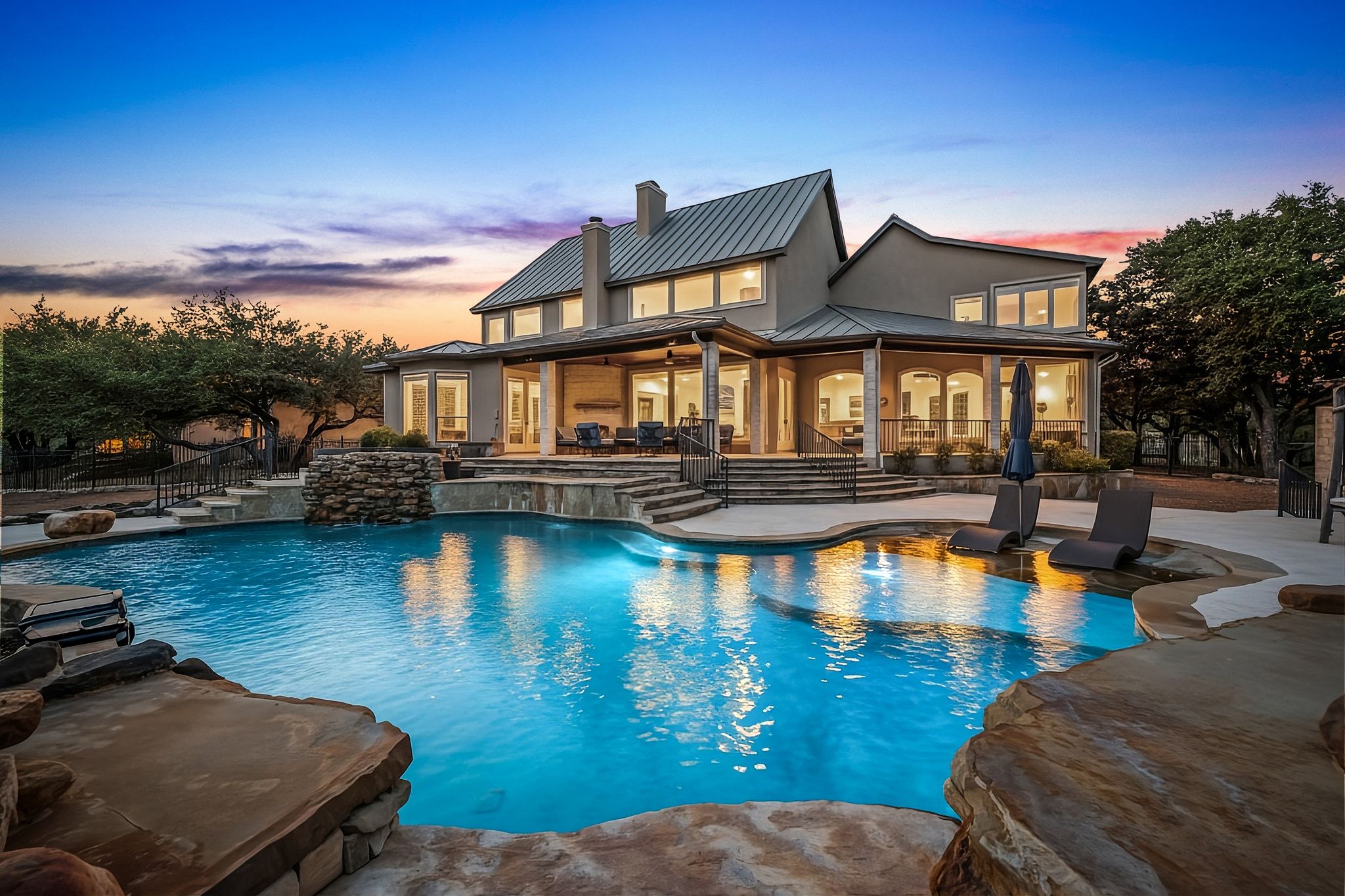 Pool at dusk featuring an outdoor pool and a patio area