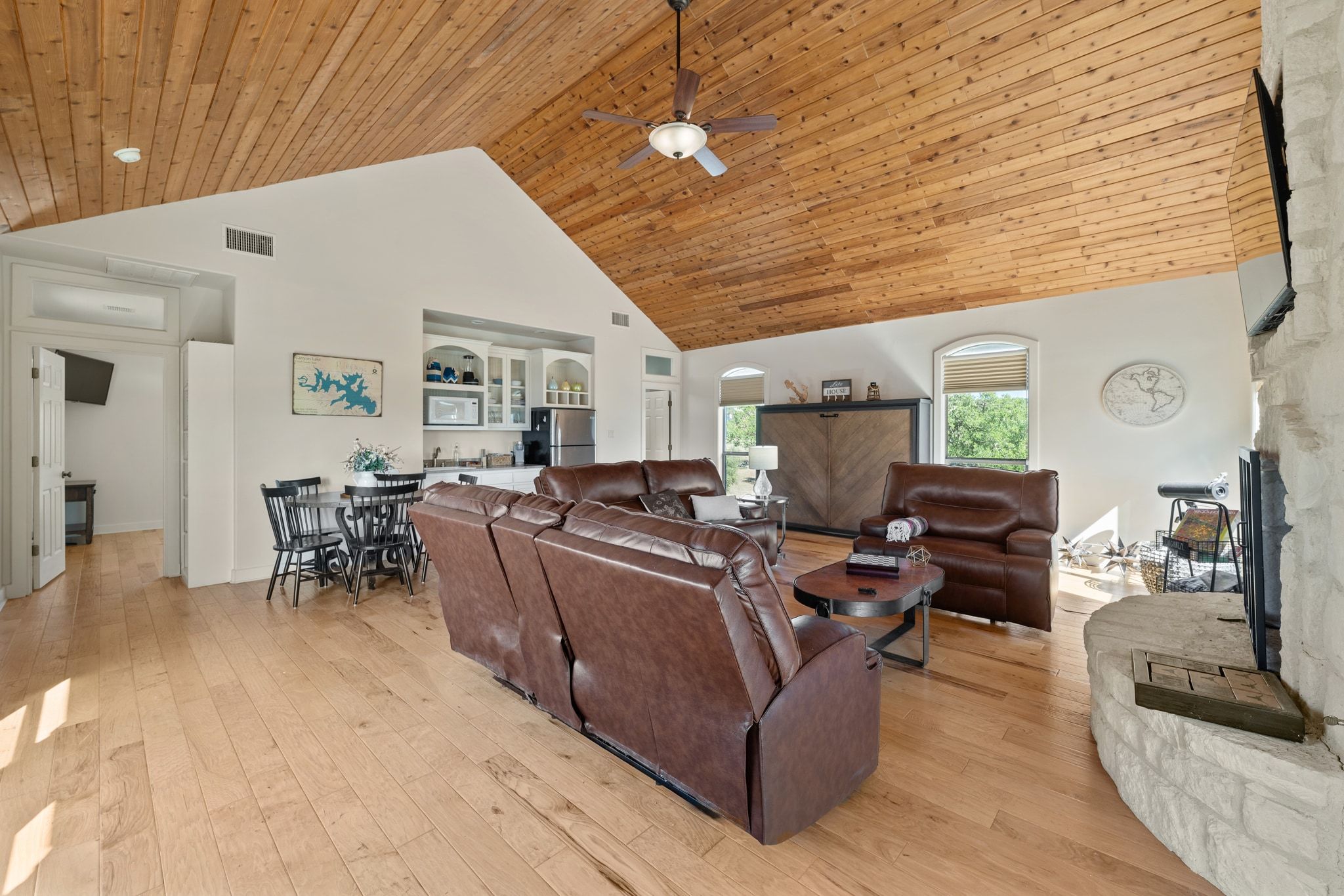 185 Shimmering Shore Court Spring Branch, TX 78070 - Photo 29 of 36 a living room with furniture and a chandelier