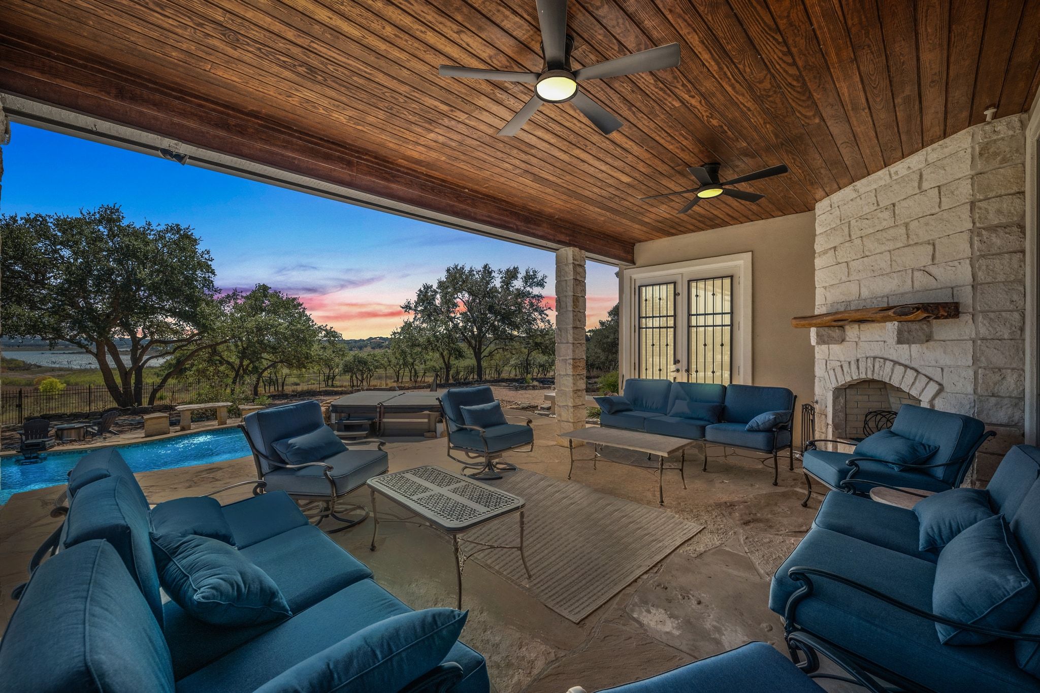185 Shimmering Shore Court Spring Branch, TX 78070 - Photo 3 of 36 a outdoor living space with furniture and a fireplace