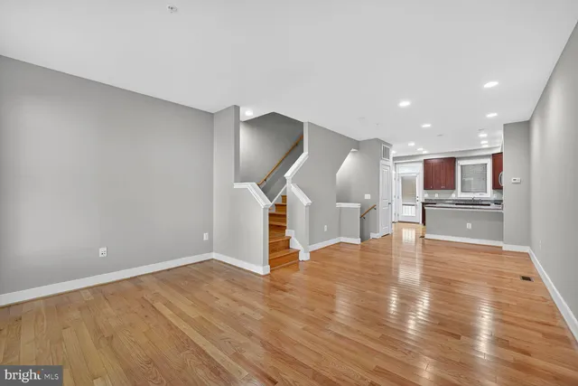 a view of a kitchen with a sink and a fireplace