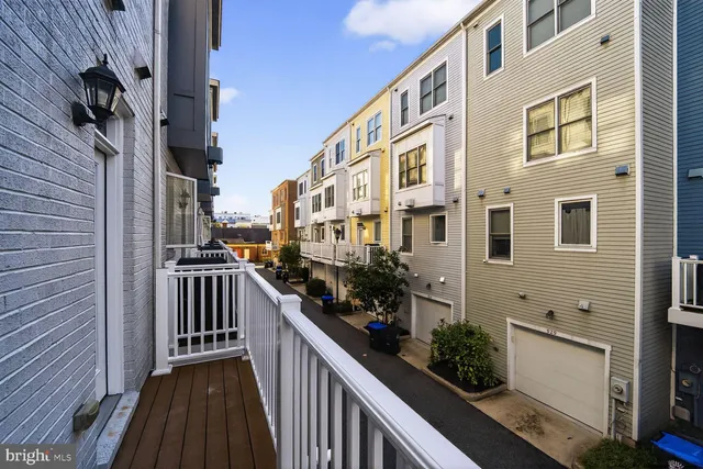 a view of a pathway and buildings from the balcony